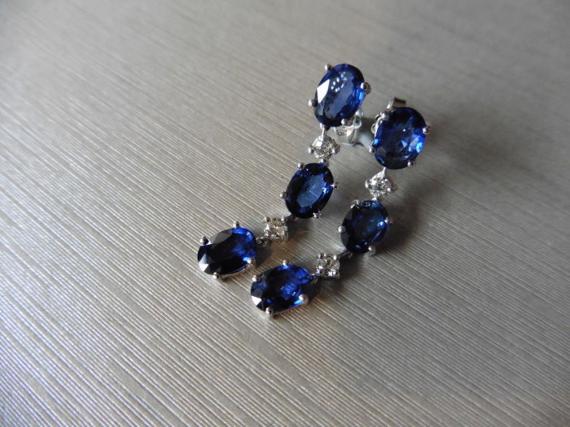Sapphire and diamond drop style earrings set in 18ct gold. Each set with 3 oval cut ( treated) - Image 2 of 3