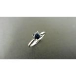 0.50ct solitaire style ring set with a round cut sapphire ( treated ) 5mm. Set in platinum with 4