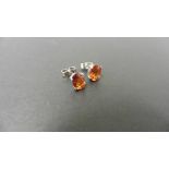 1.60ct citrine stud style earrings set in 9ct white gold. 7 x 5mm oval cut citrines set in a 4