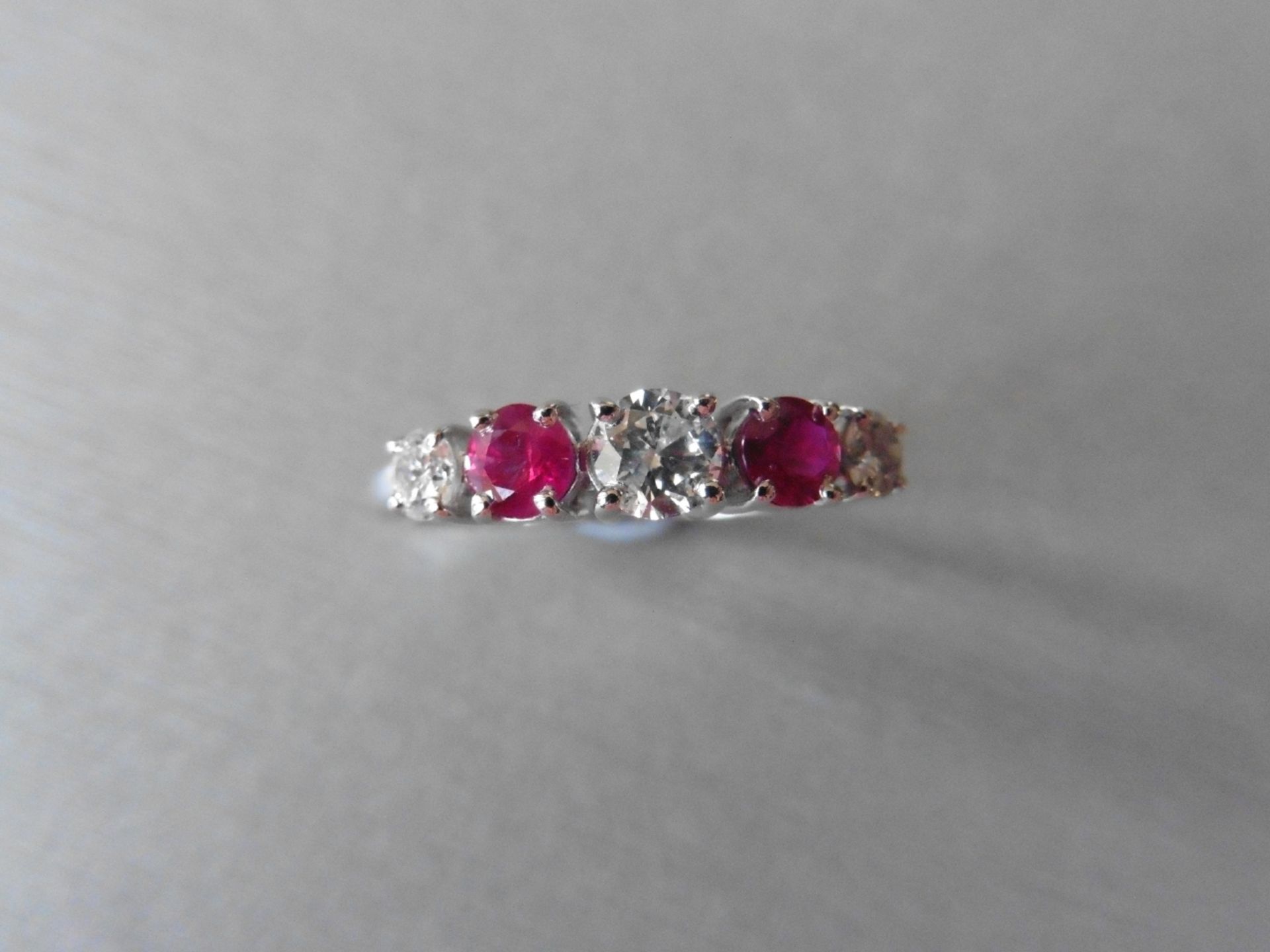 0.75ct ruby and diamond five stone ringset in 18ct gold. 2 rubies( treated ) 3 brilliant cut - Image 3 of 3