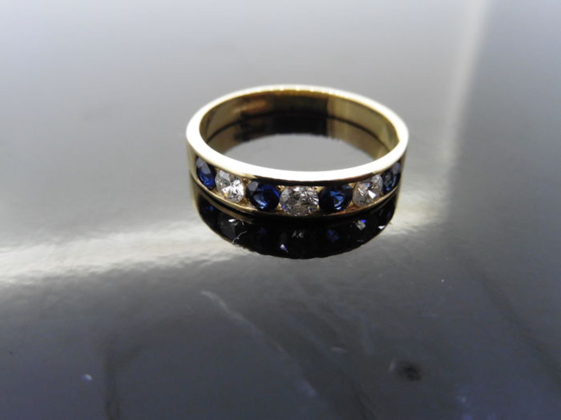 Sapphire and diamond eternity band ring set in 9ct yellow gold. 4 small round cut sapphires ( - Image 3 of 3