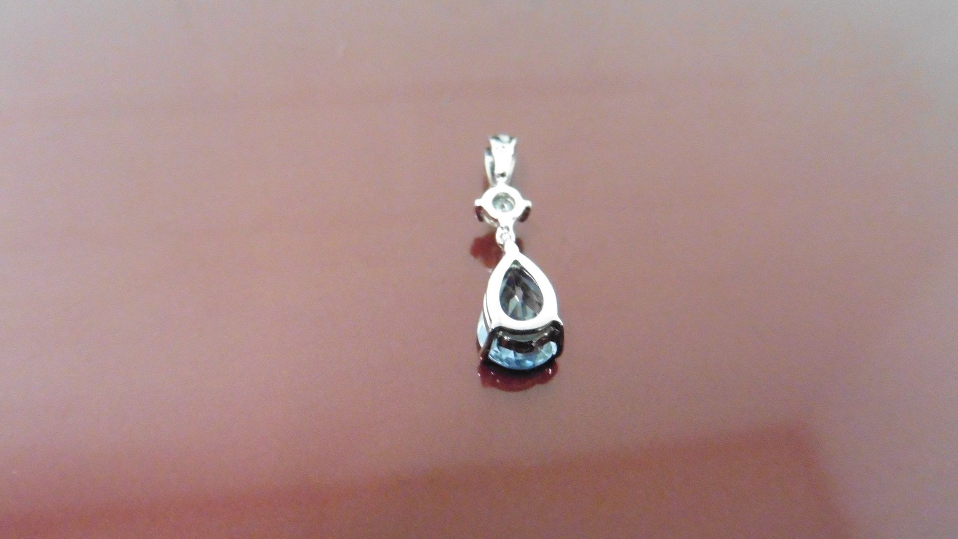 0.35ct Aqua Marine and diamond drop style pendant ( no chain ).Pear shaped aqua ( treated ) 0.35ct - Image 2 of 3