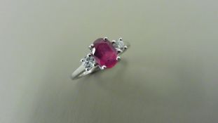 0.80ct ruby and diamond trilogy ring. 7x 5mm oval cut ruby ( glass filled) with a small diamond