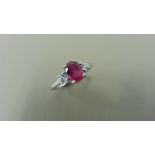 0.80ct ruby and diamond trilogy ring. 7x 5mm oval cut ruby ( glass filled) with a small diamond