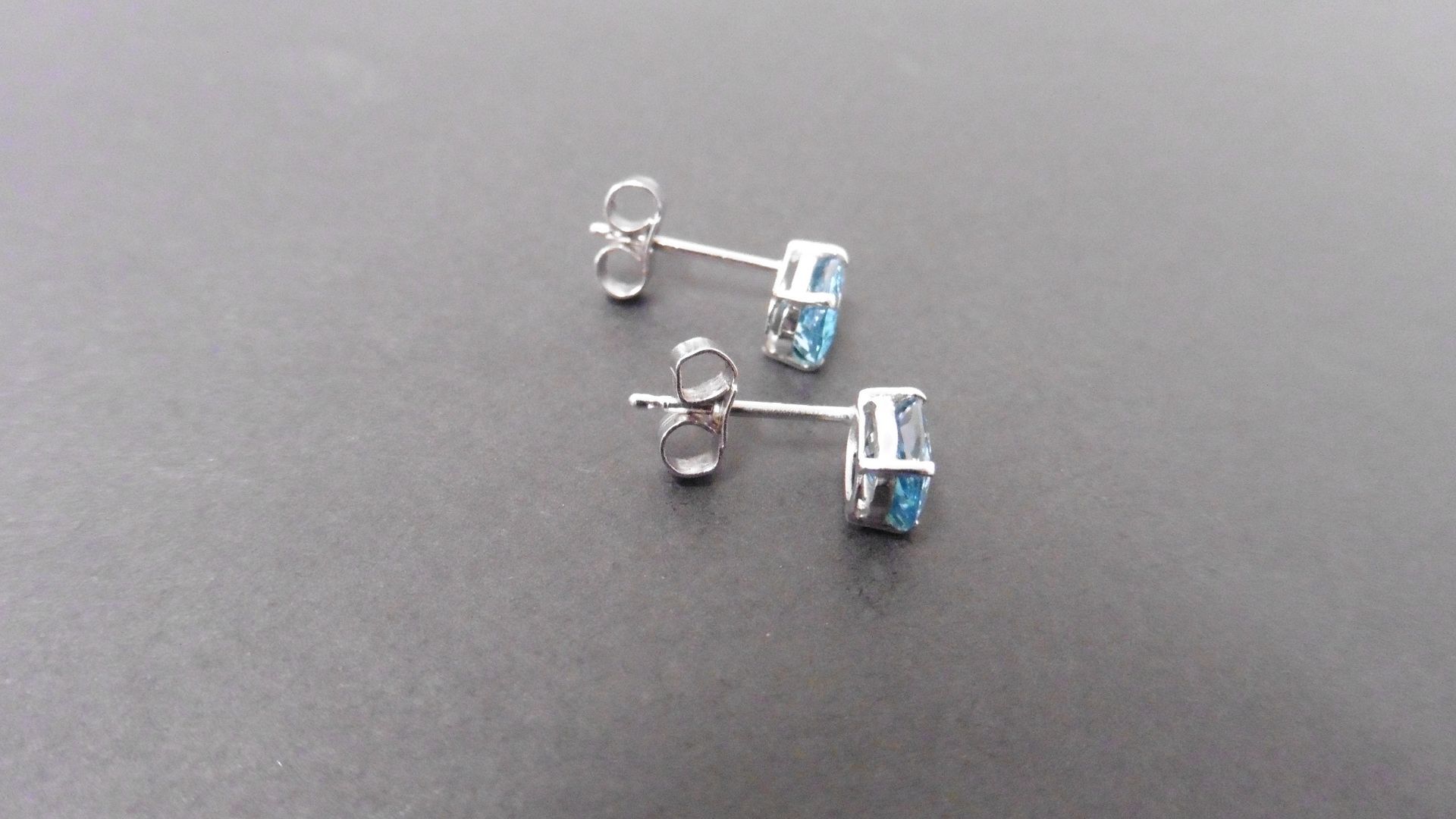 1.60ct zircon stud style earrings set in 9ct white gold. 7 x 5mm oval cut blue zircons set in a 4 - Image 2 of 2