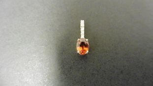 0.80ct citrine and diamond drop style pendant. 7X 5mm oval citrine set with 5 small brilliant cut