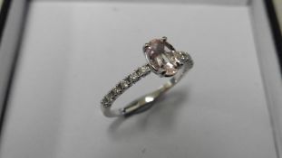 0.80ct / 0.12ct morganite and diamond dress ring. Oval cut ( treated ) morganite with small diamonds