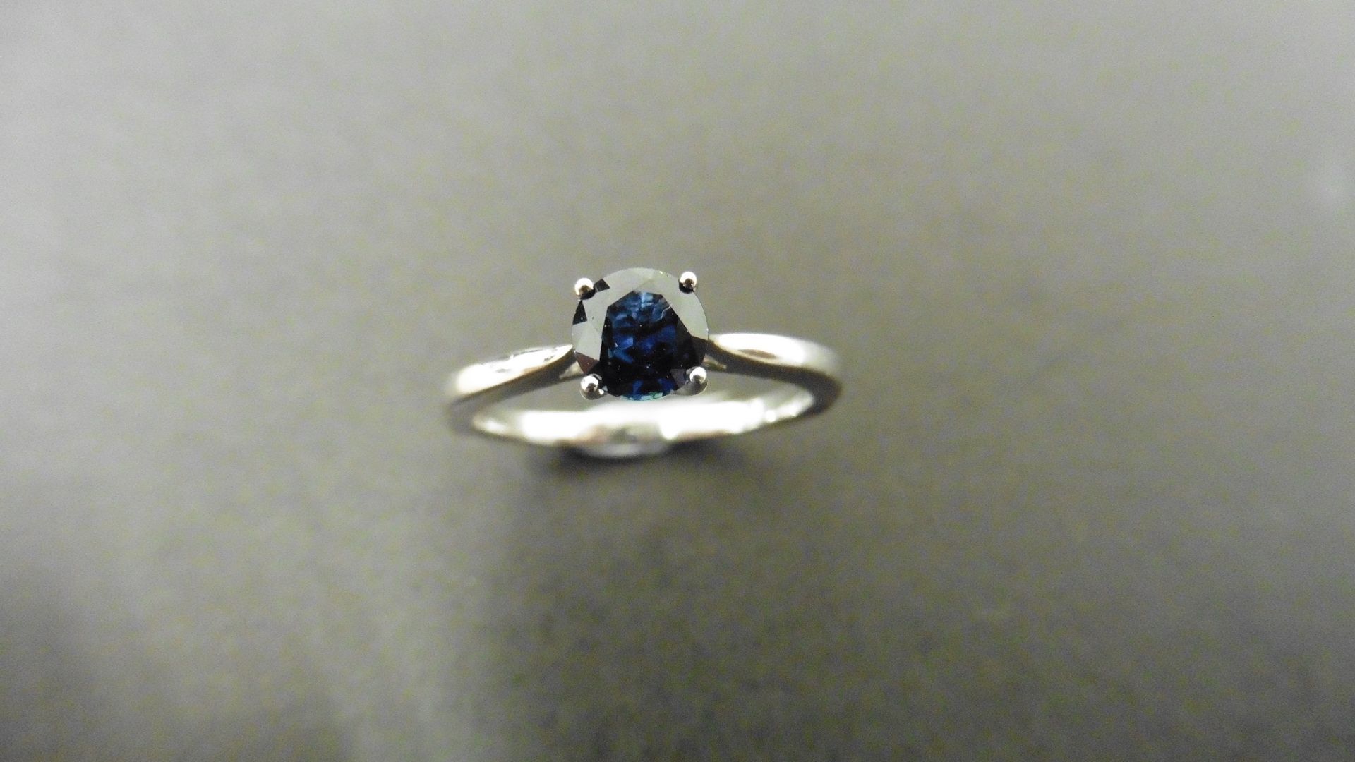 0.50ct solitaire style ring set with a round cut sapphire ( treated ) 5mm. Set in platinum with 4 - Image 4 of 4