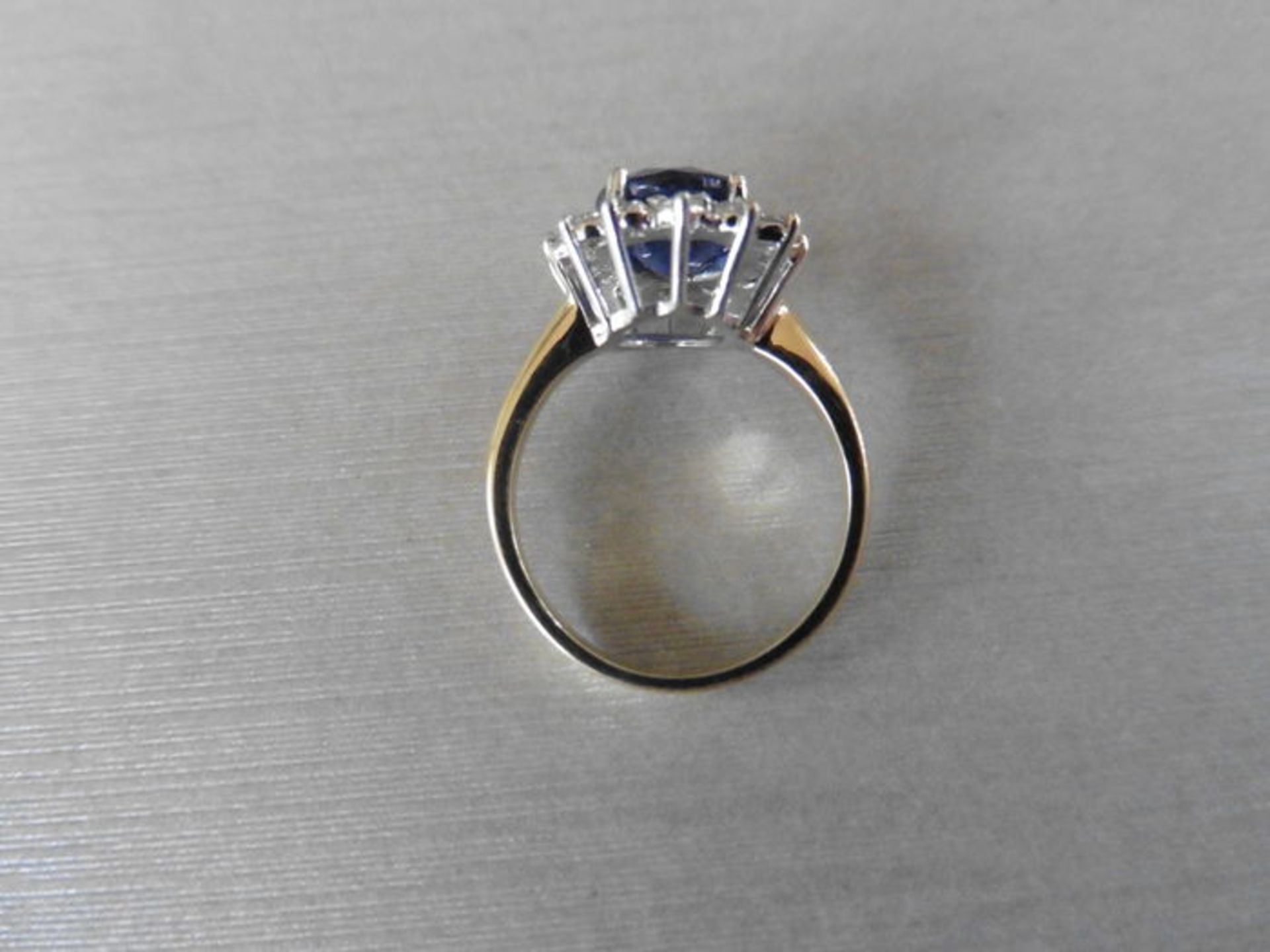 2.40ct sapphire and diamond cluster ring set with a oval cut (glass filled) sapphire which is - Image 3 of 3