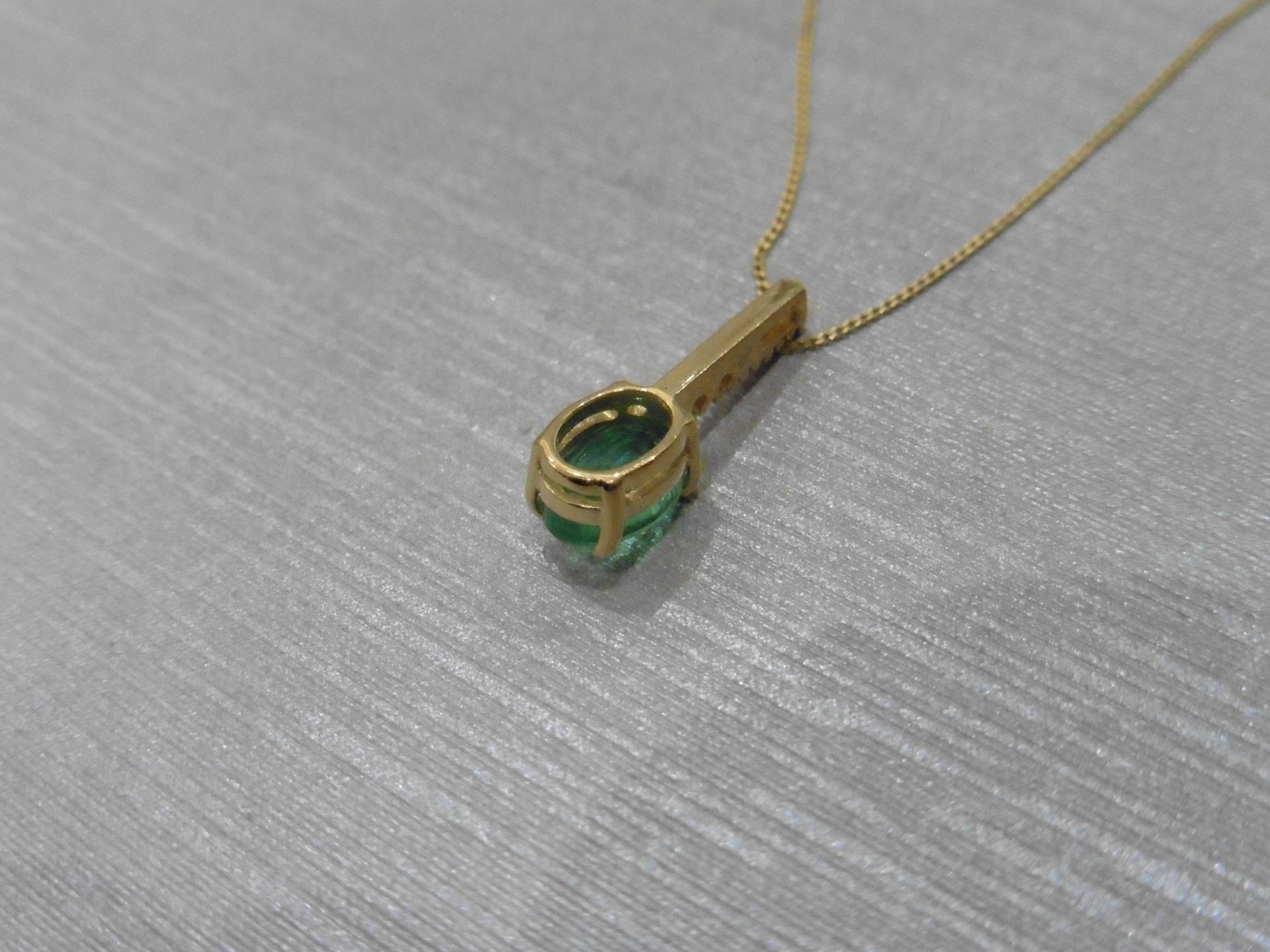 0.80ct emerald and diamond drop style pendant. 7X 5mm oval emerald set with 5 small brilliant cut - Image 3 of 3