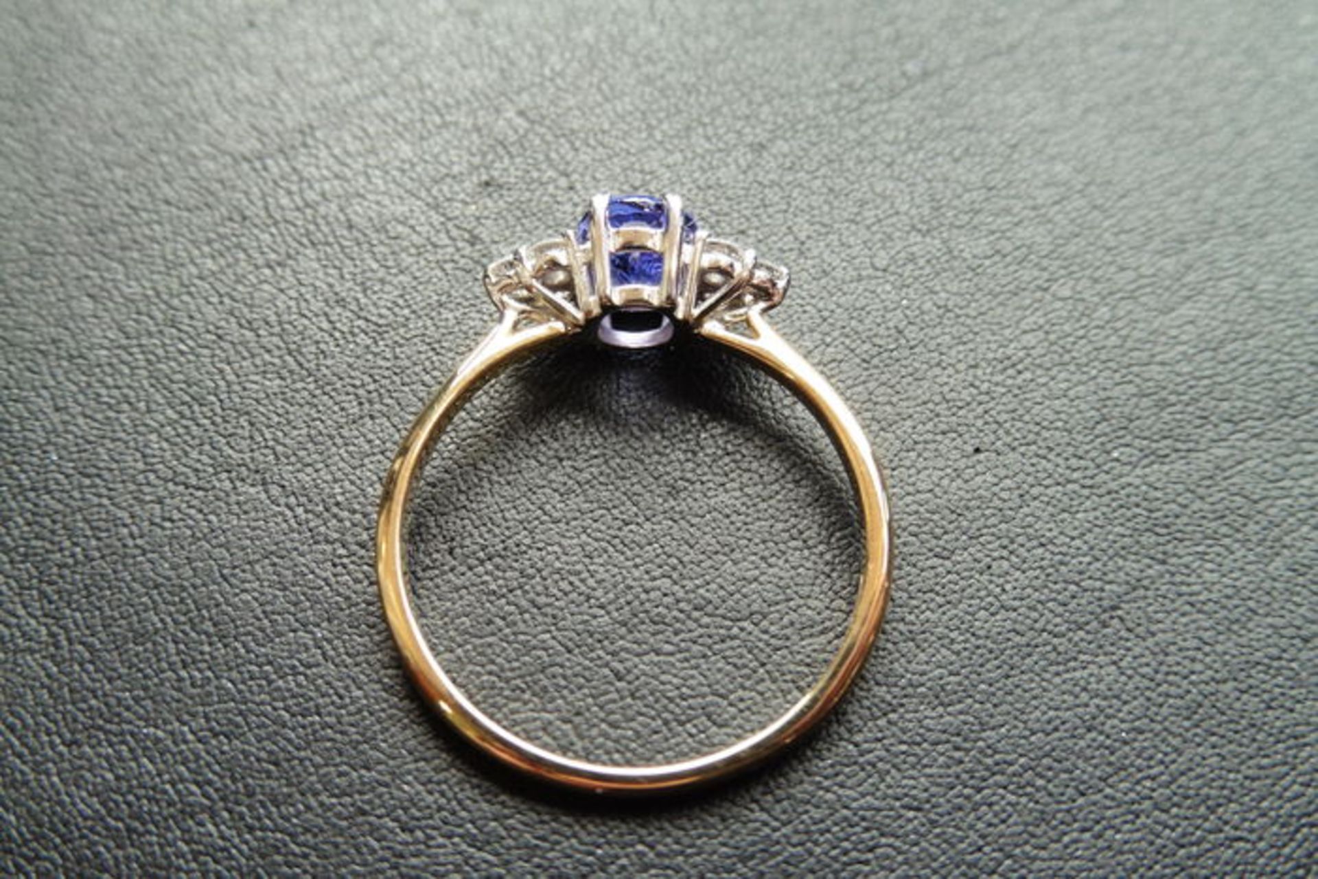 0.80ct tanzanite and diamond dress ring. Oval cut ( treated ) tanzanite with 3 small brilliant cut - Image 2 of 3