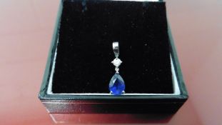 0.35ct sapphire and diamond drop style pendant ( no chain ).Pear shaped sapphire ( glass filled )