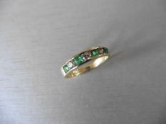 Emerald and diamond eternity style ring. Set with 4 round cut emeralds ( treated )0.40ct and 3