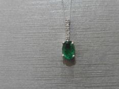 0.80ct emerald and diamond drop style pendant. 7X 5mm oval emerald set with 5 small brilliant cut