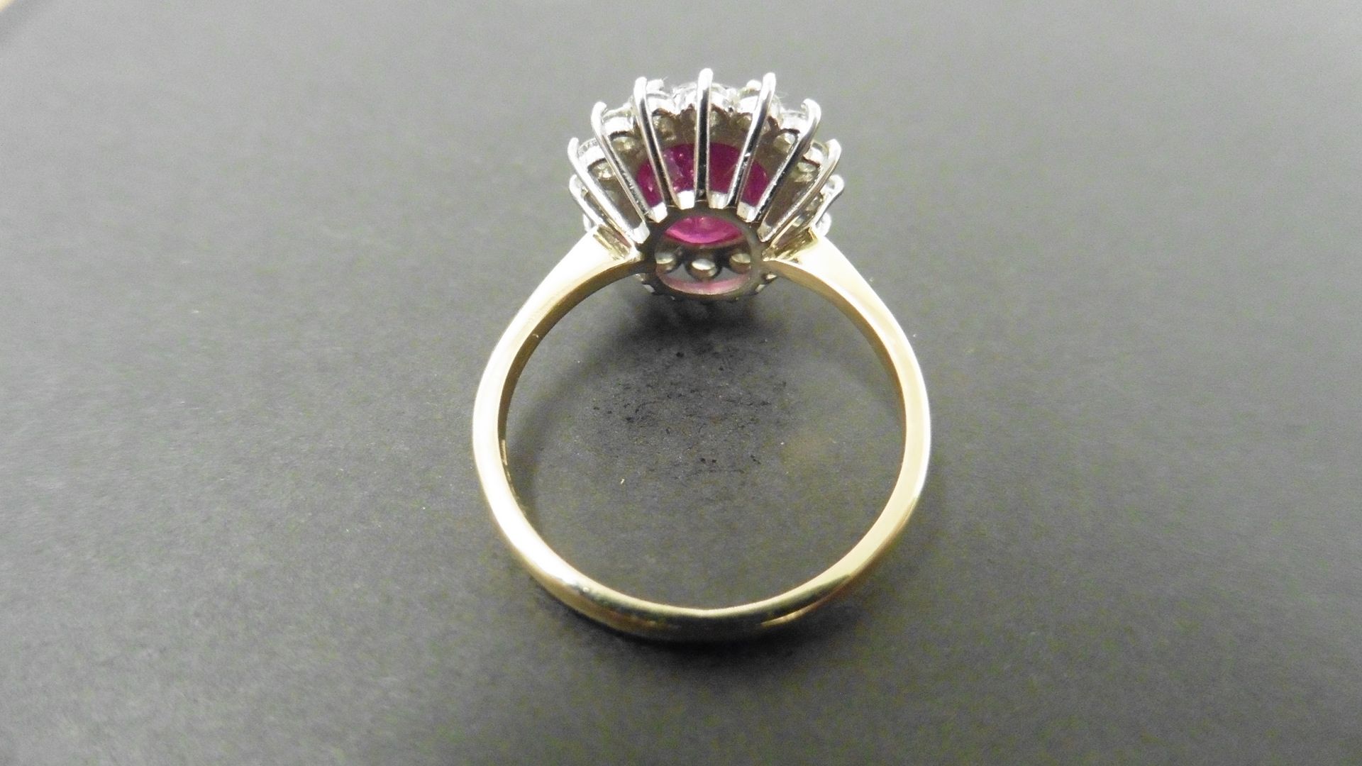 2.40ct ruby and diamond cluster ring set with a oval cut(glass filled) ruby which is surrounded by - Image 2 of 4