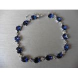 11ct sapphire and diamond bracelet.Set with oval ( treated ) sapphires and small brilliant cut