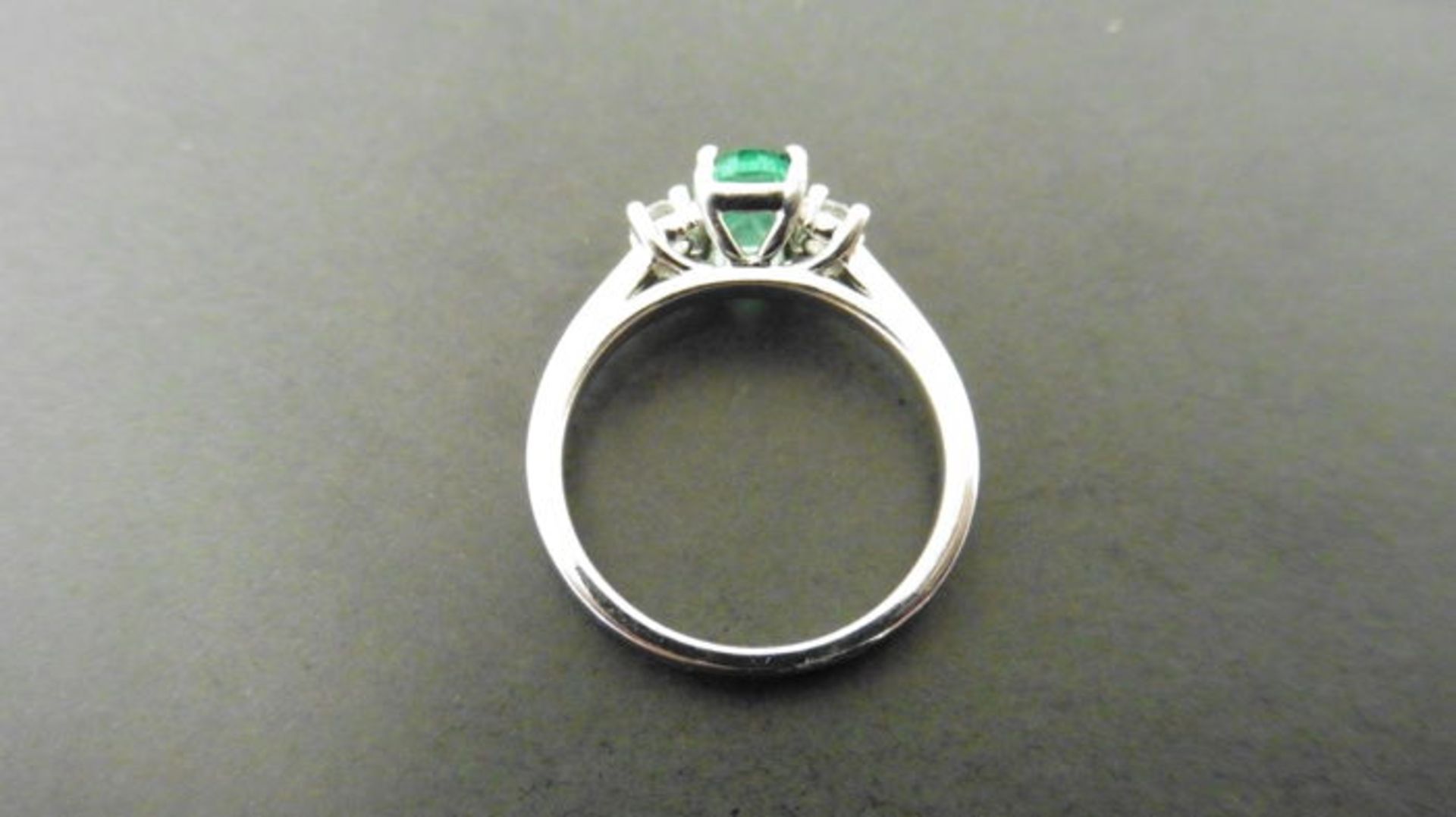 0.80ct emerald and diamond trilogy ring. 7x 5mm oval cut emerald ( oil treated) with a small diamond - Image 3 of 4