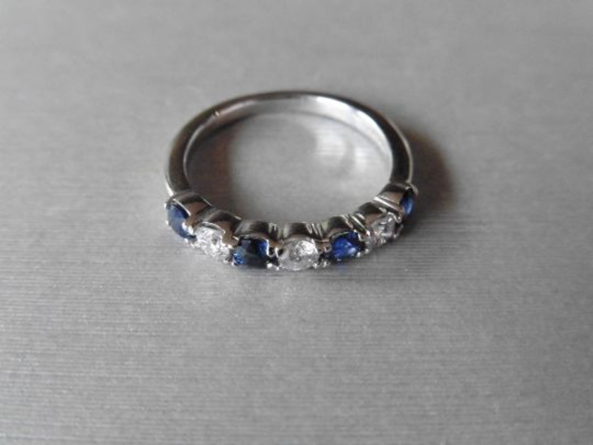 Sapphire and diamond eternity style band ring with 4round cut sapphires and 3 brilliant cut - Image 3 of 3