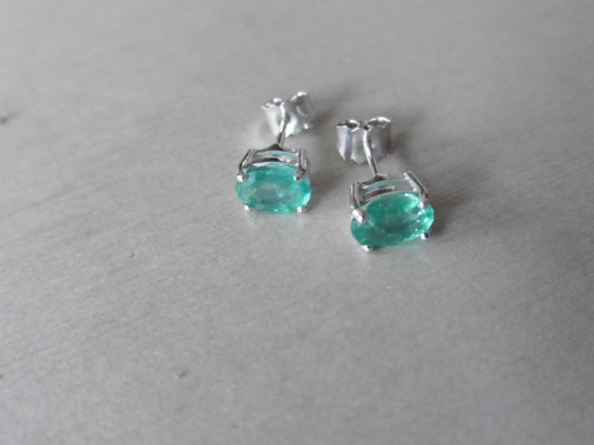 1.60ct emerald stud style earrings set in 9ct white gold. 7 x 5mm oval cut emeralds ( treated) set - Image 2 of 2