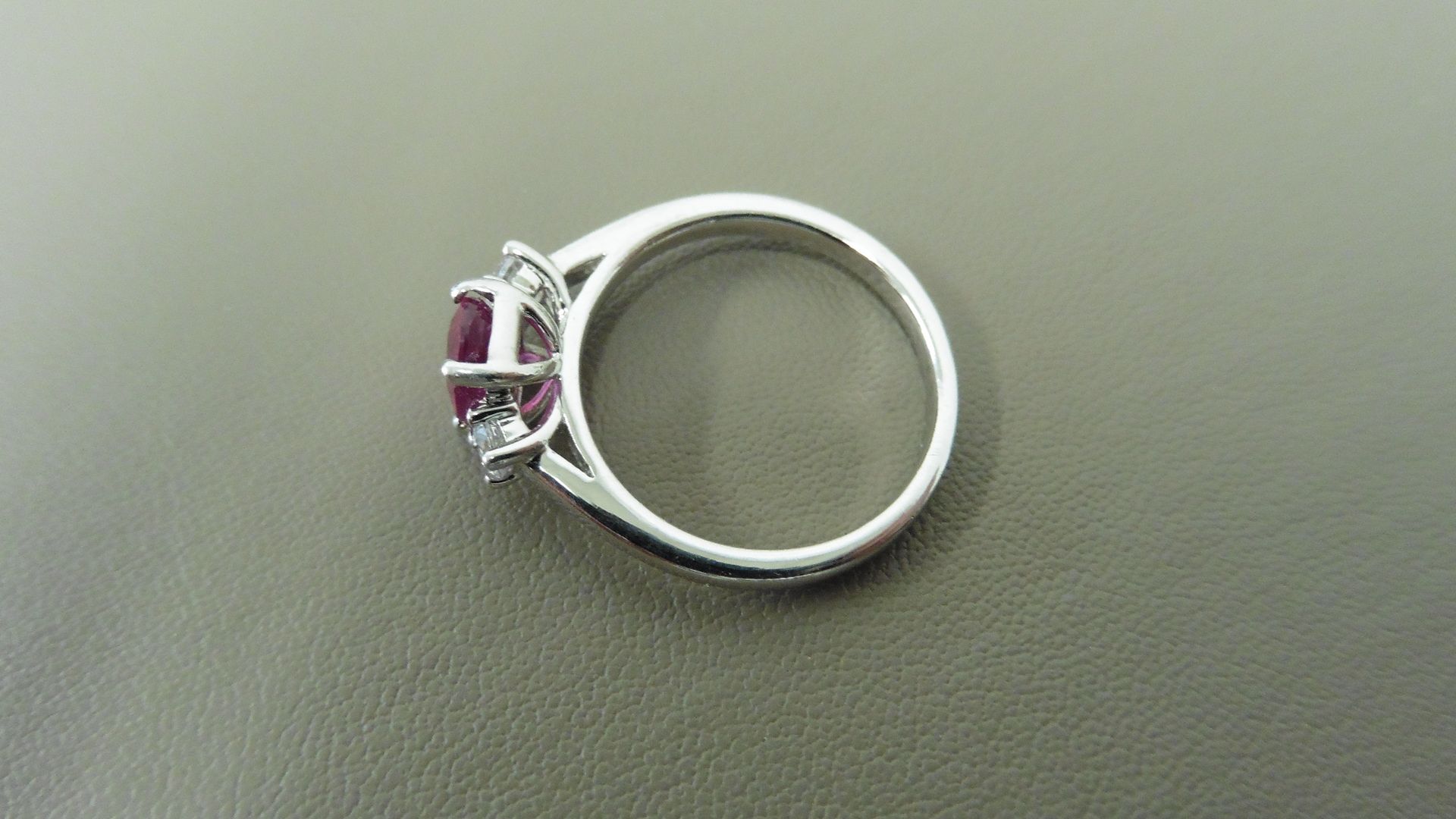 0.80ct ruby and diamond trilogy ring. 7x 5mm oval cut ruby ( glass filled) with a small diamond - Image 3 of 4