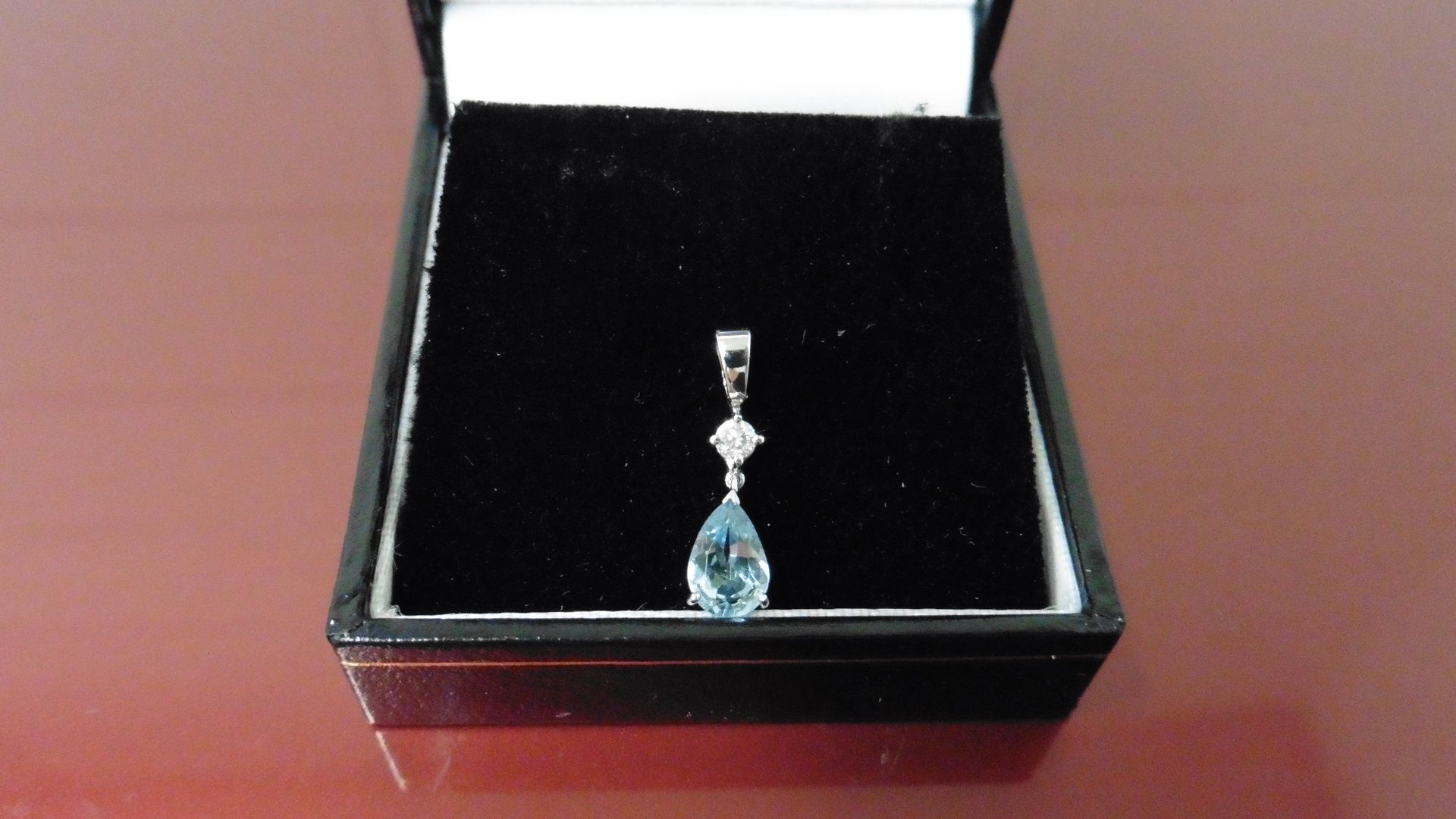 0.35ct Aqua Marine and diamond drop style pendant ( no chain ).Pear shaped aqua ( treated ) 0.35ct