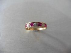 Ruby and diamond eternity band ring set in 9ct yellow gold. 4 small round cut rubies ( treated ) 0.