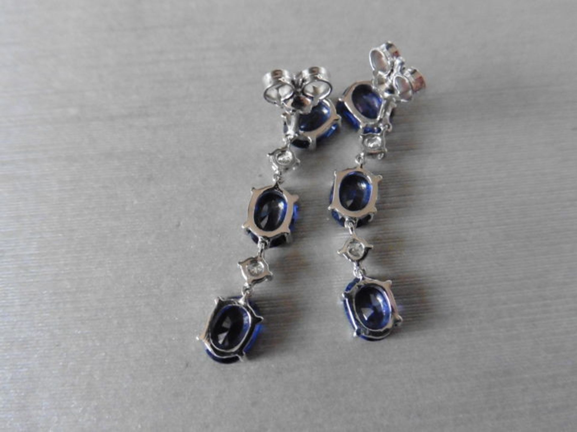 Sapphire and diamond drop style earrings set in 18ct gold. Each set with 3 oval cut ( treated) - Image 3 of 3