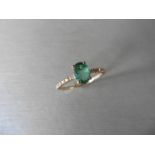 0.80ct / 0.12ct Emerald and diamond dress ring. Oval cut ( oil treated) emerald with small