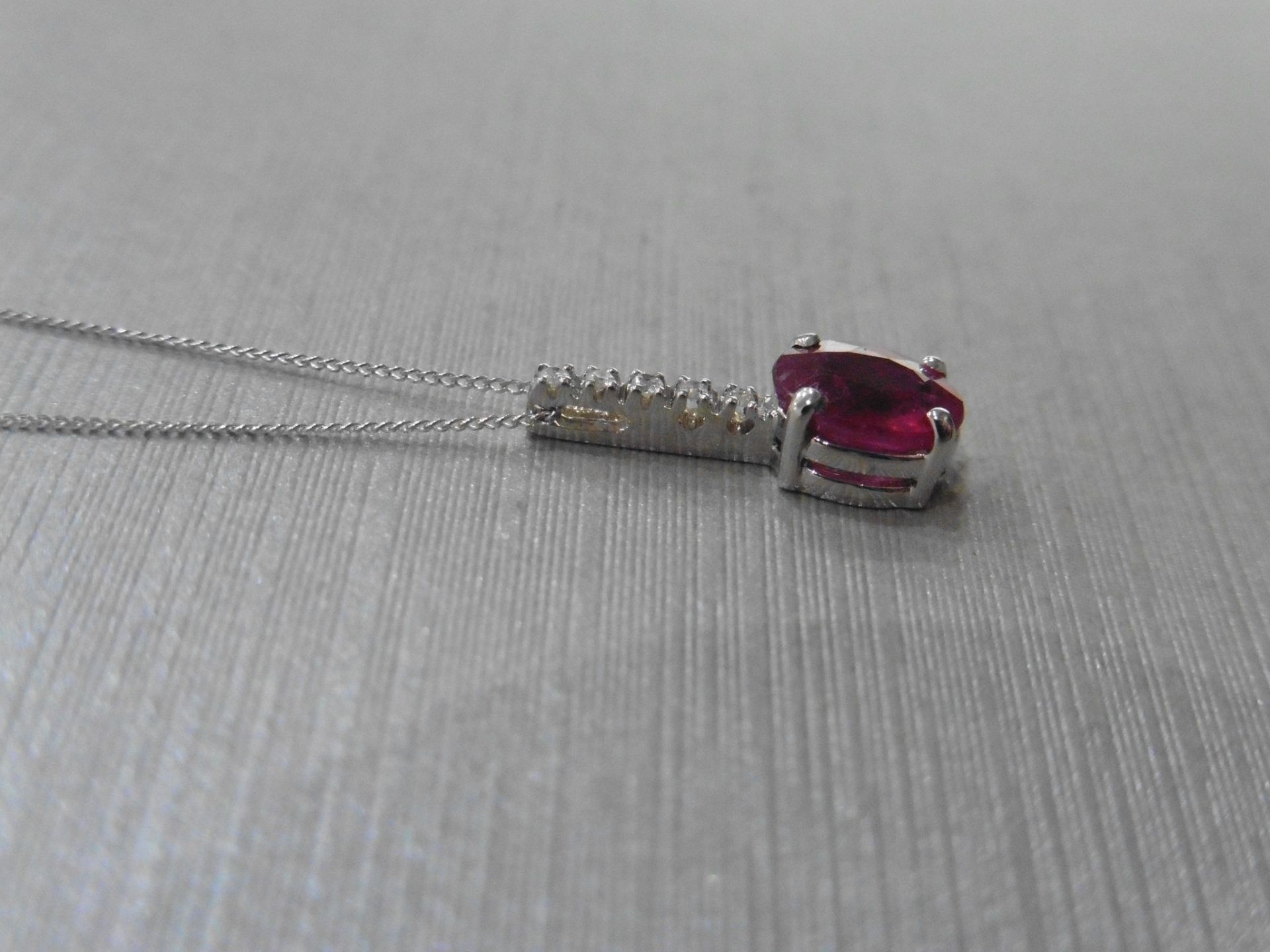 0.80ct Ruby and diamond drop style pendant. 7X 5mm oval ruby set with 5 small brilliant cut - Image 2 of 3