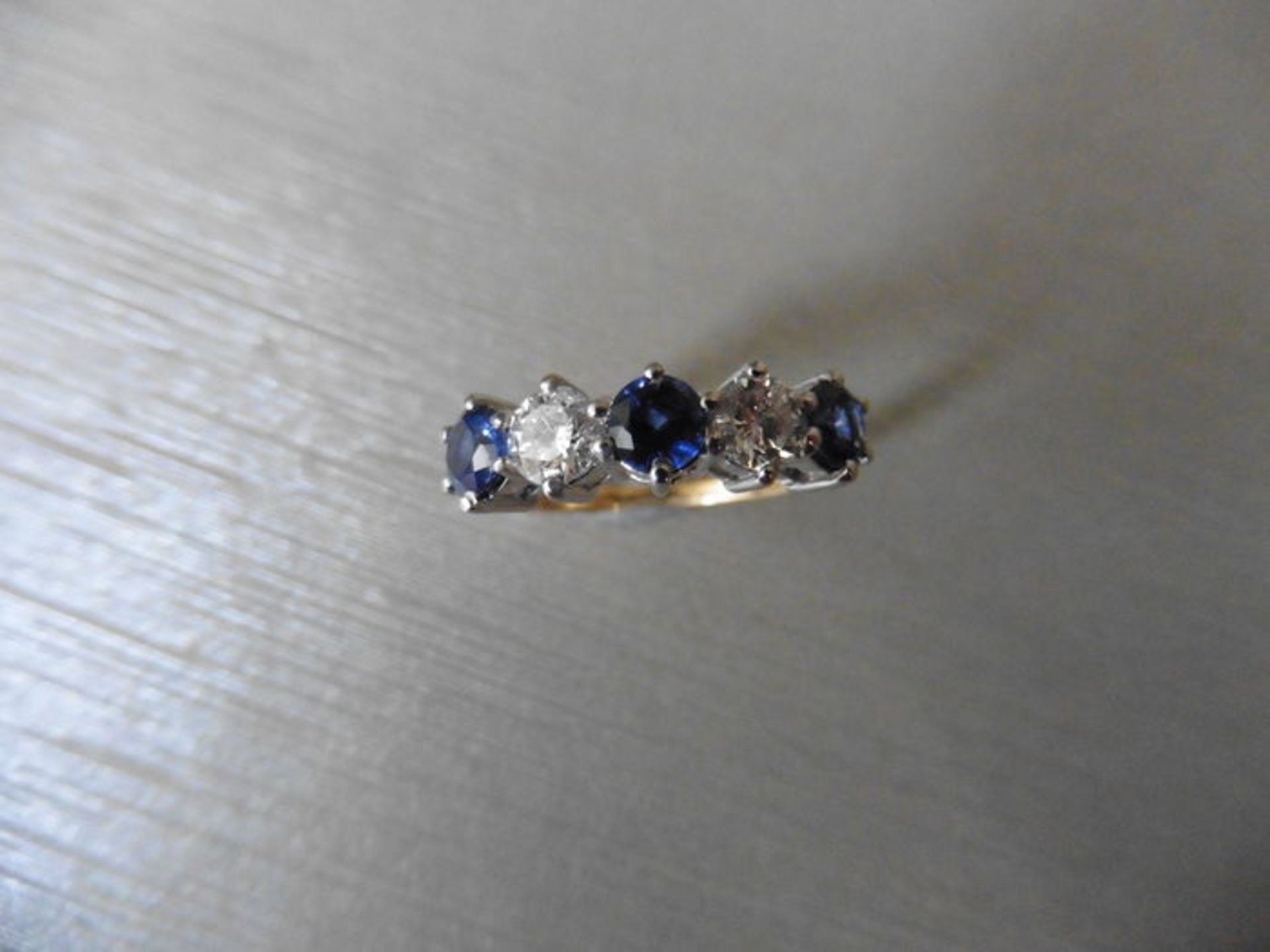 Sapphire and diamond five stone ring. 3 round cut sapphires ( treated ) 3.5mm and 2 brilliant cut - Image 3 of 3