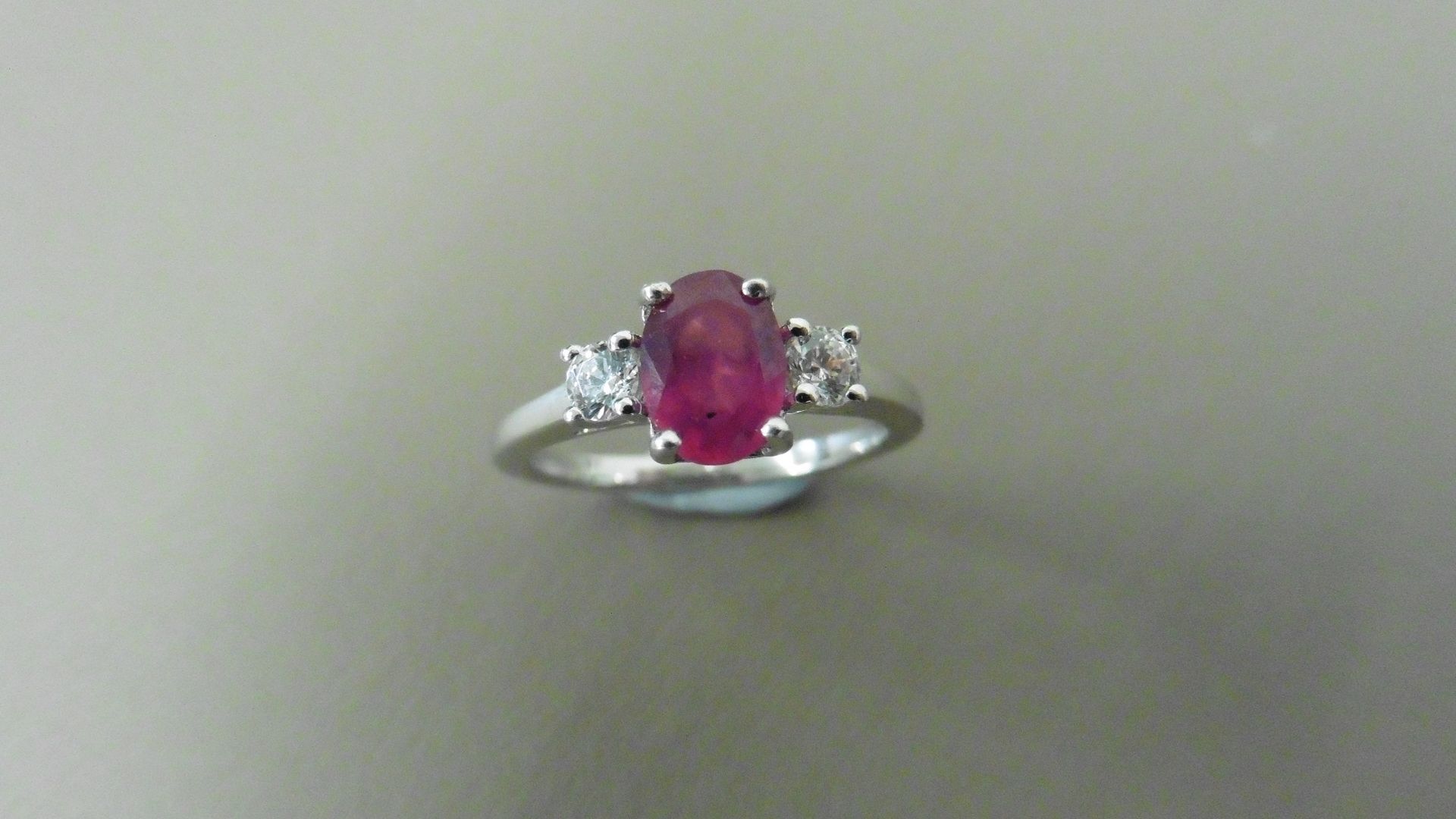 0.80ct ruby and diamond trilogy ring. 7x 5mm oval cut ruby ( glass filled) with a small diamond - Image 4 of 4