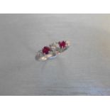 0.75ct ruby and diamond five stone ringset in 18ct gold. 2 rubies( treated ) 3 brilliant cut