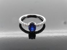 0.80ct / 0.12ct sapphire and diamond dress ring. Oval cut ( treated ) sapphire with small diamonds