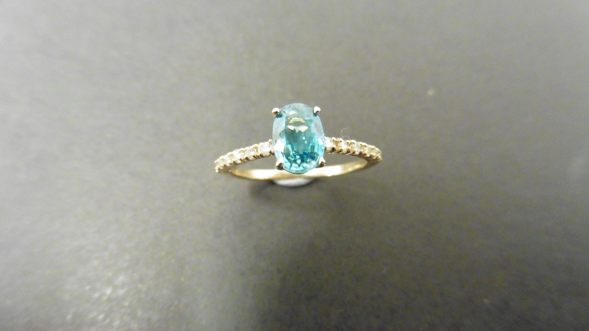 0.80ct / 0.12ct blue zircon and diamond dress ring. Oval cut ( treated ) zircon with small - Image 3 of 4