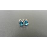 1.60ct zircon stud style earrings set in 9ct white gold. 7 x 5mm oval cut blue zircons set in a 4