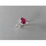 0.80ct Ruby and diamond cluster ring set with a oval cut(glass filled) ruby which is surrounded by