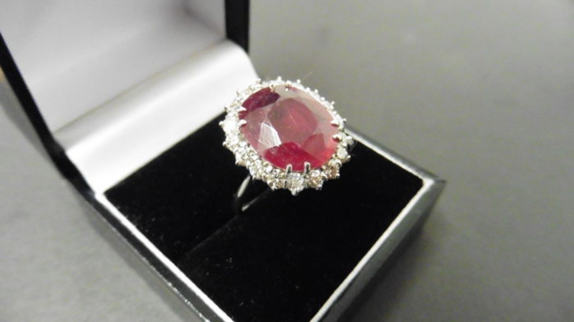 9ct ruby and diamond cluster ring. Oval cut ruby( glass filled) in the centre surrounded by - Image 4 of 4
