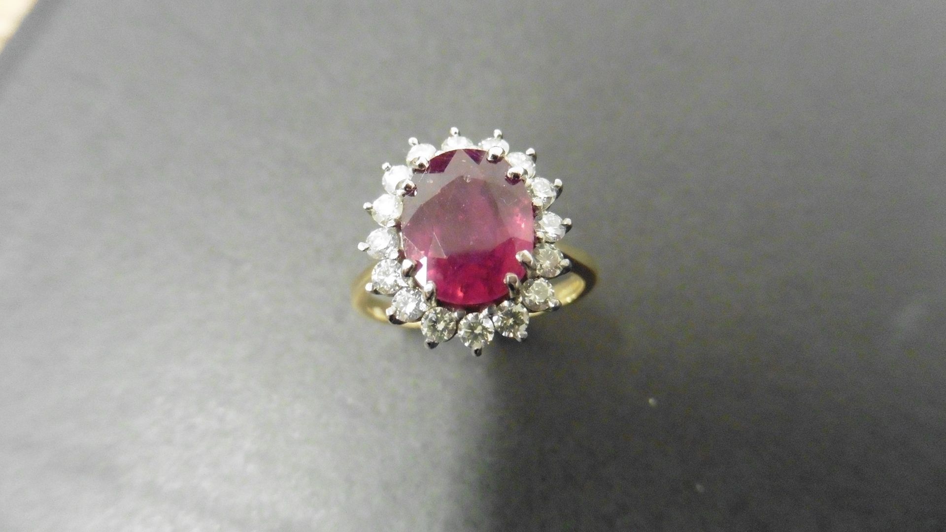 2.40ct ruby and diamond cluster ring set with a oval cut(glass filled) ruby which is surrounded by - Image 4 of 4