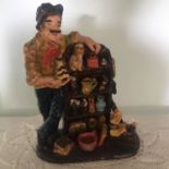 Large and very detailed studio pottery figure group of an antique dealer