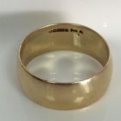 9ct gold wedding ring - 8mm band - Birmingham hallmarks - Size N