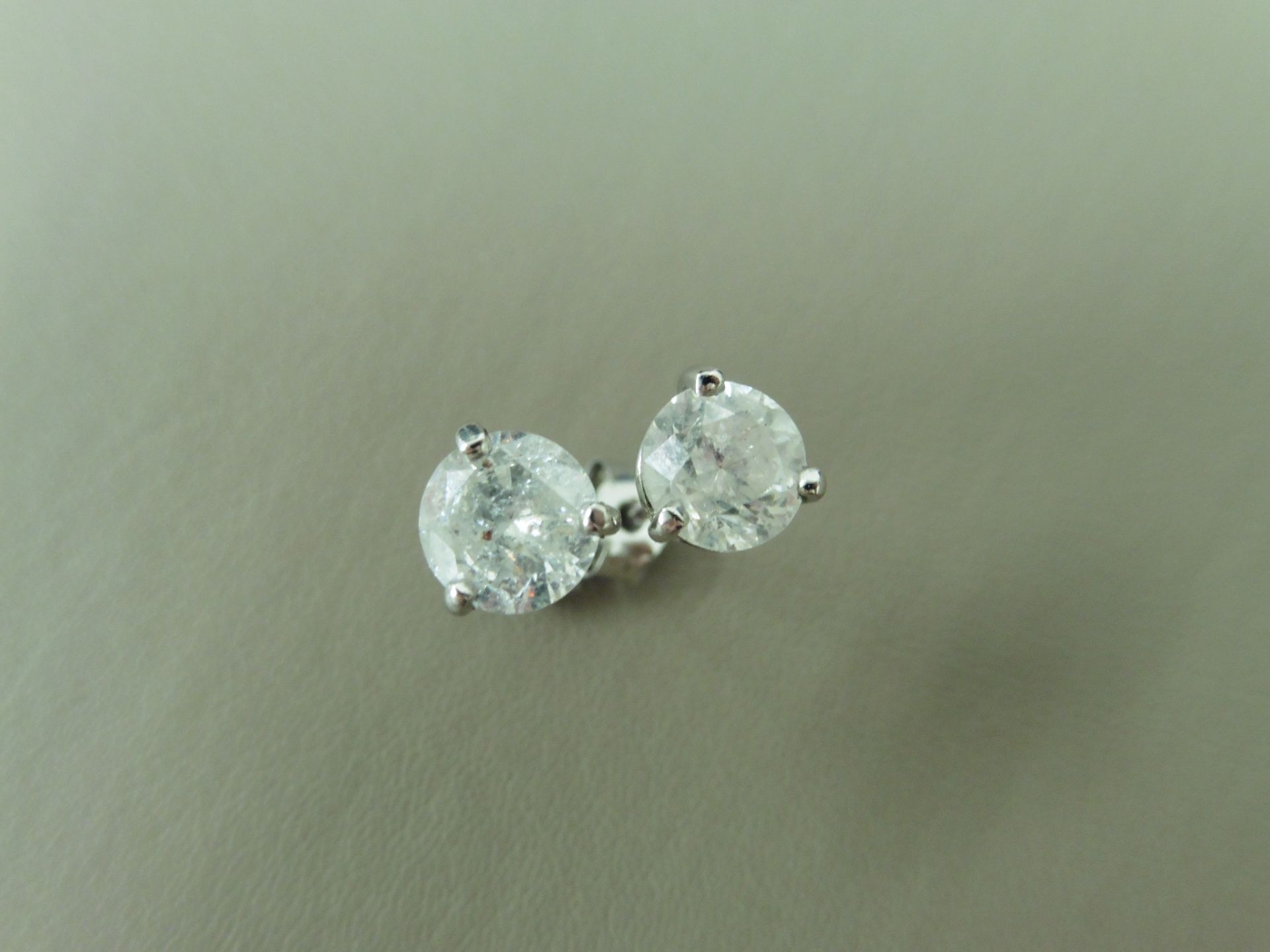 2.00ct Solitaire diamond stud earrings set with brilliant cut diamonds which have been enhanced. I