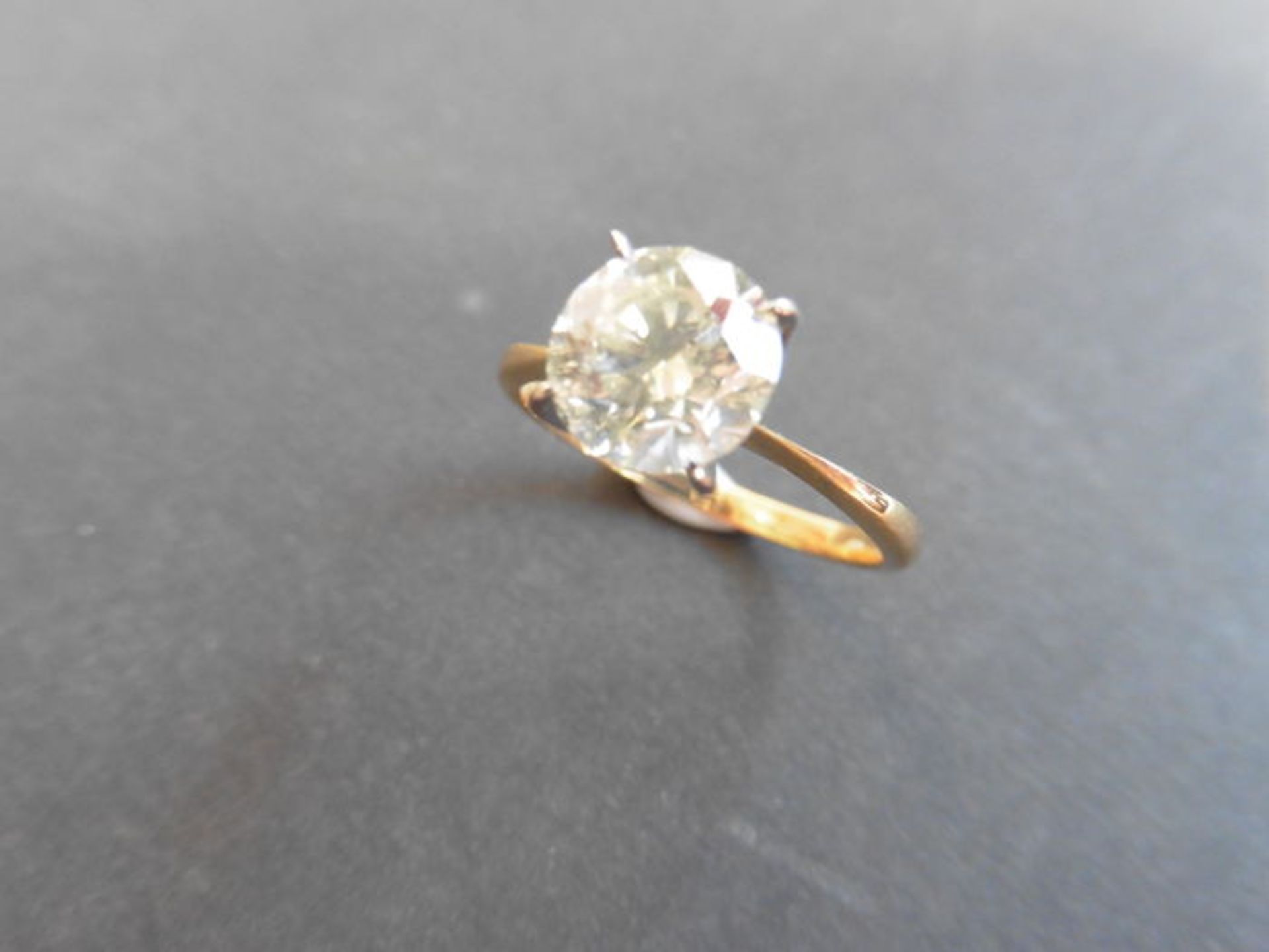 2.00ct diamond solitaire ring set in 18ct gold. Enchanced diamond, H colour and I2 clarity. 4 claw