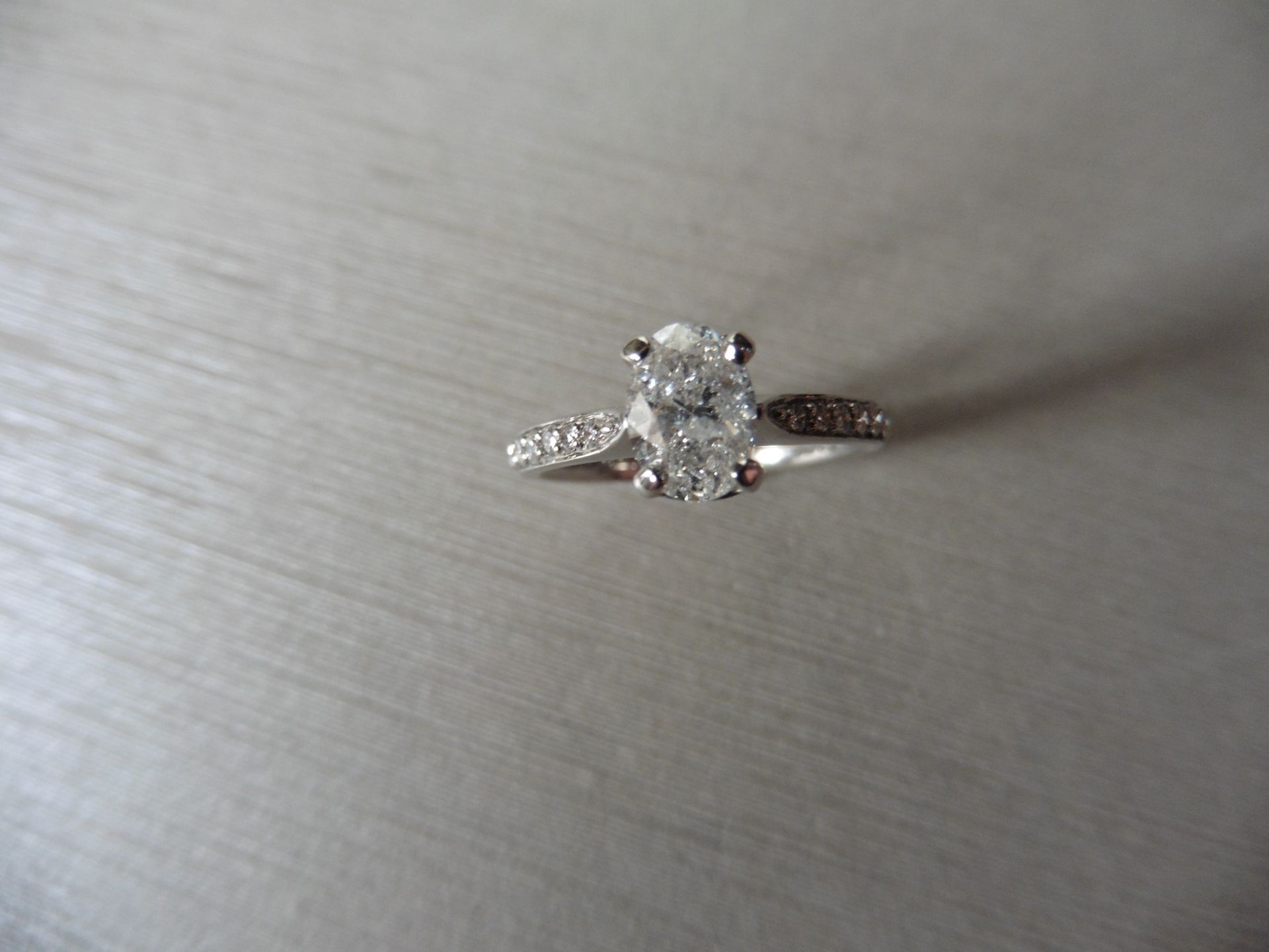 0.82ct oval diamond set solitaire ring. Centre diamond G/H colour, Si3 clarity. Shoulders micro