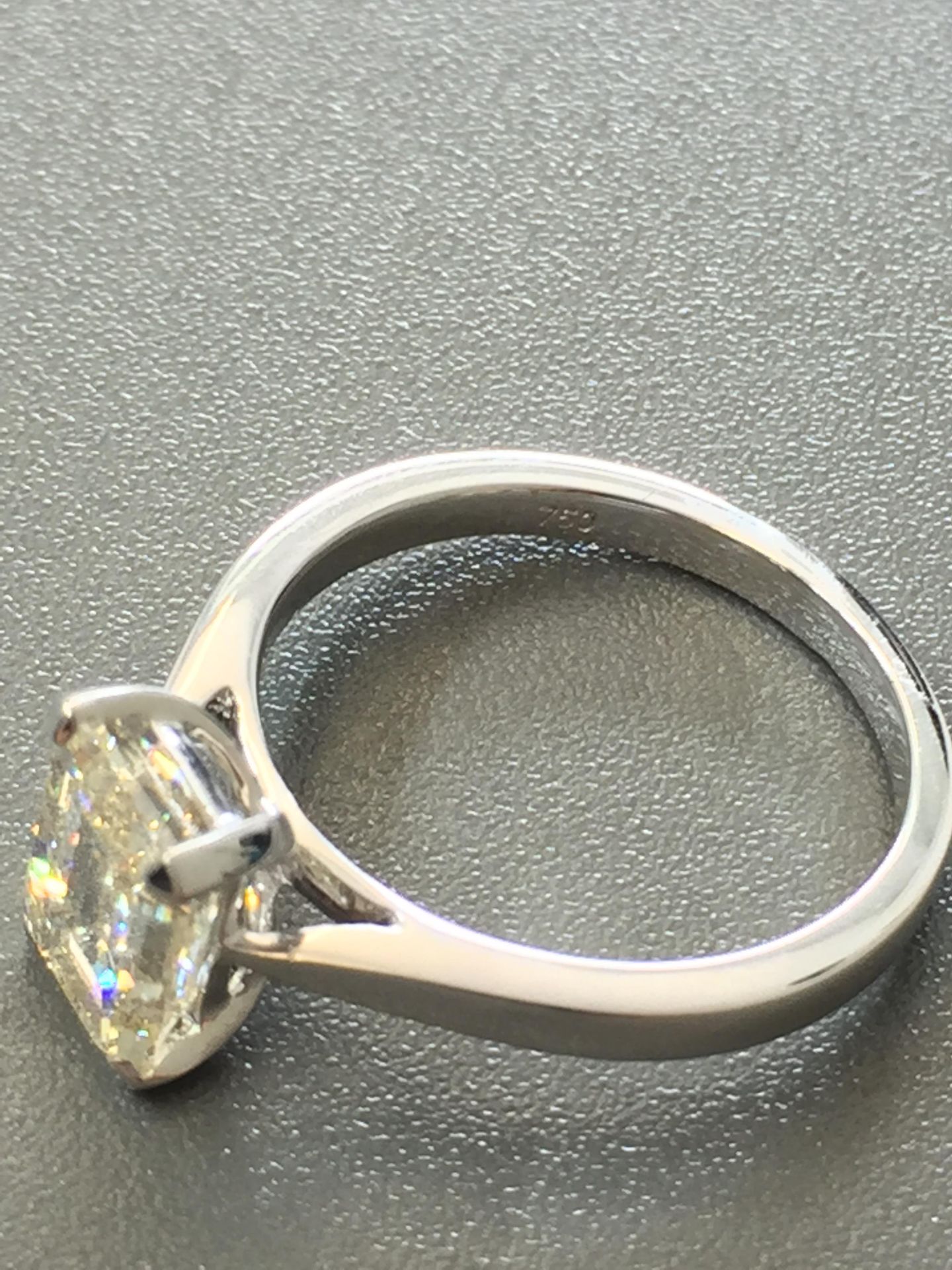 2ct diamond solitaire ring set with an emerald cut diamond, N ( light brown ) colour and VS1 - Image 2 of 5