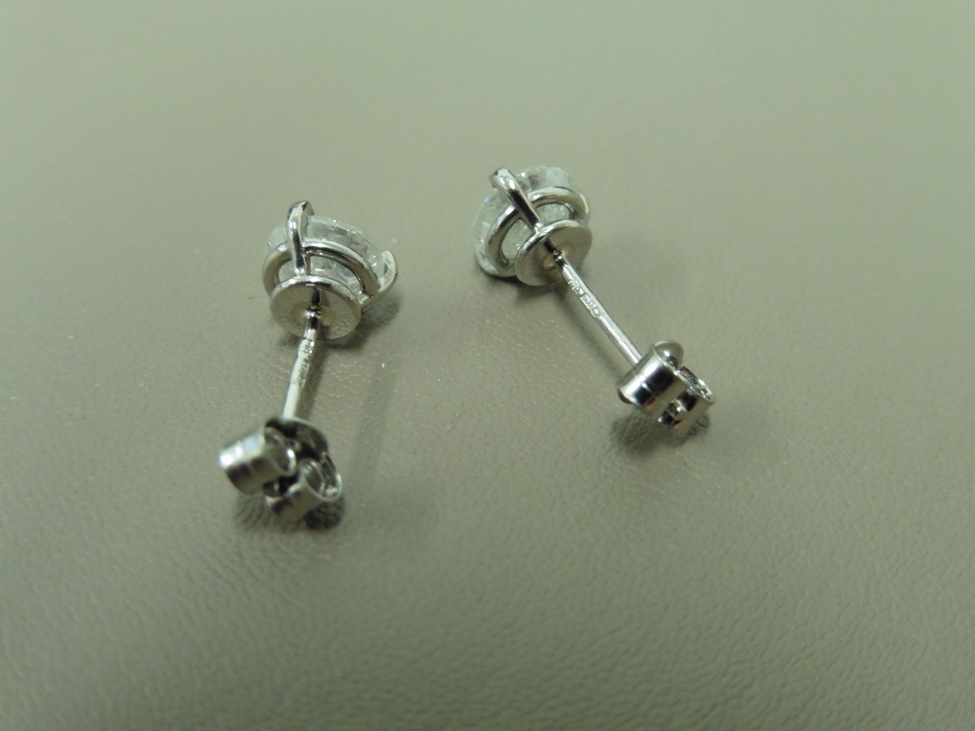 2.00ct Solitaire diamond stud earrings set with brilliant cut diamonds which have been enhanced. I - Image 2 of 2