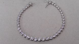 3.50ct tennis style bracelet set with brilliant cut diamonds. I colour, Si2 clarity. 18ct white