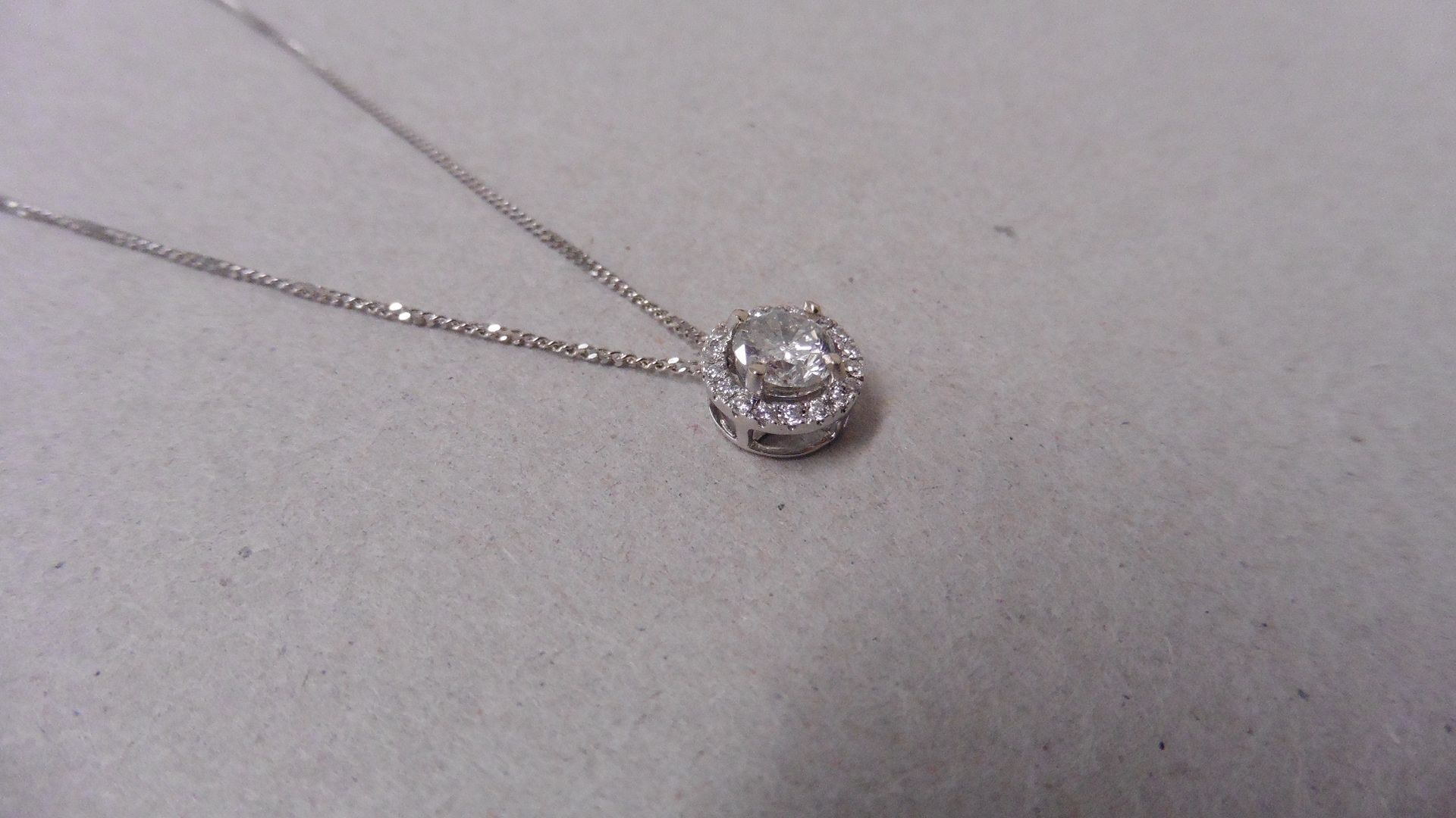 0.70ct diamond set pendant. Brilliant cut diamond I-J colour, si2-I1 clarity. Halo setting with - Image 2 of 4