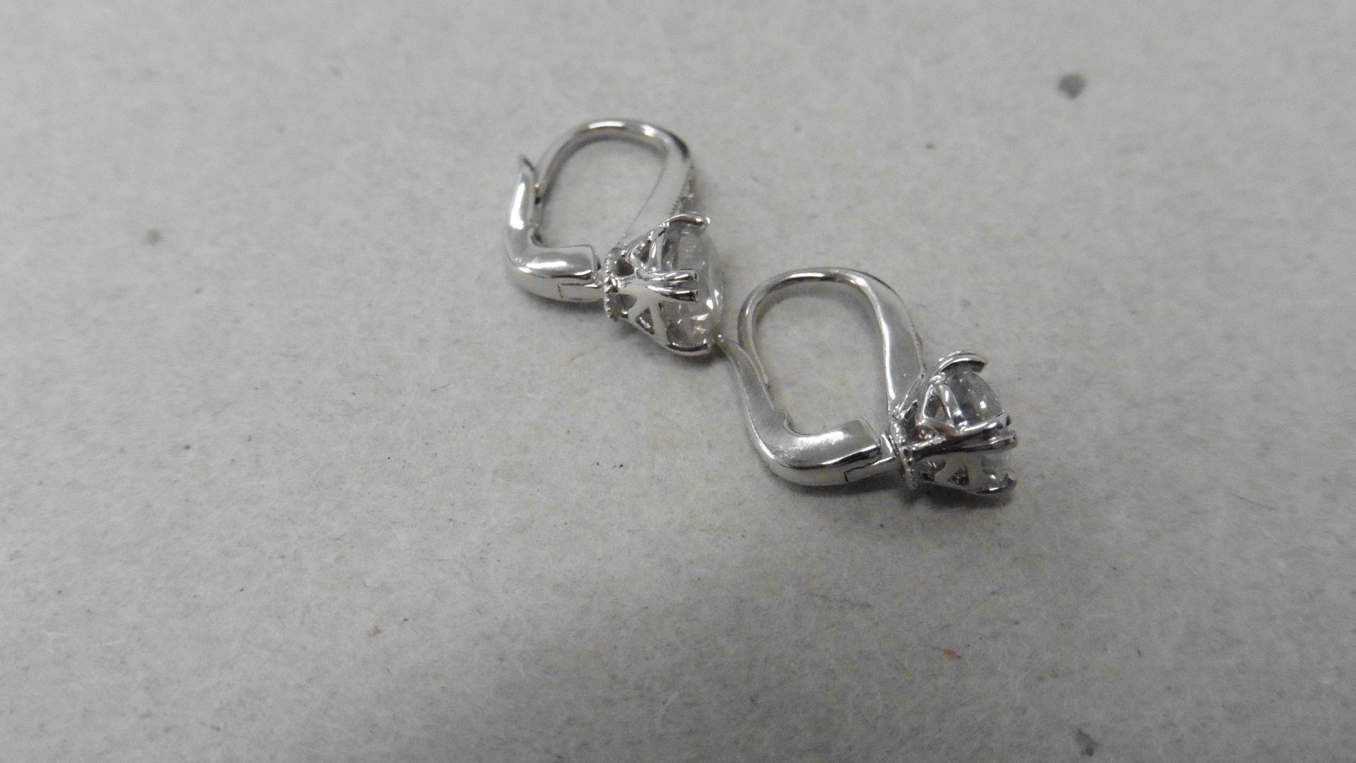 18ct white gold hoop style earrings with hinge fastners. Brilliant cut diamonds, I colour and I1 - Image 2 of 4