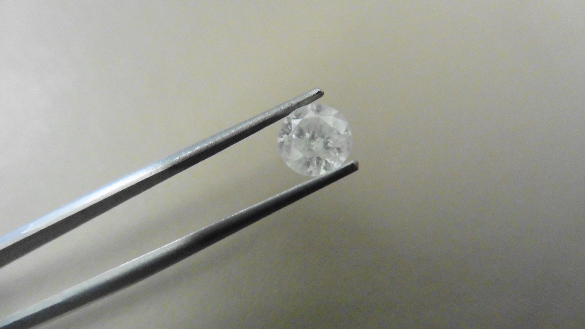 1.17ct Brilliant Cut Diamond, Enhanced stone. H colour, I2 clarity. 6.56 x 4.17mm. Valued at £