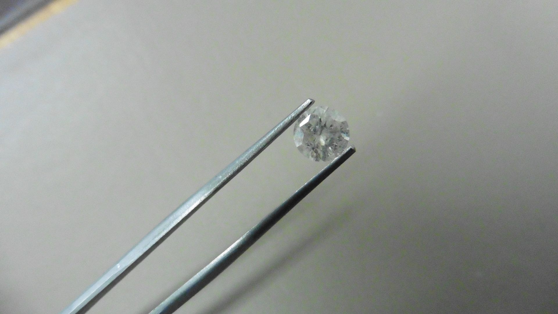1.01ct Brilliant Cut Diamond, Enhanced stone.I colour, I2 clarity. 6.34 x 3.93mm. Valued at £1490.